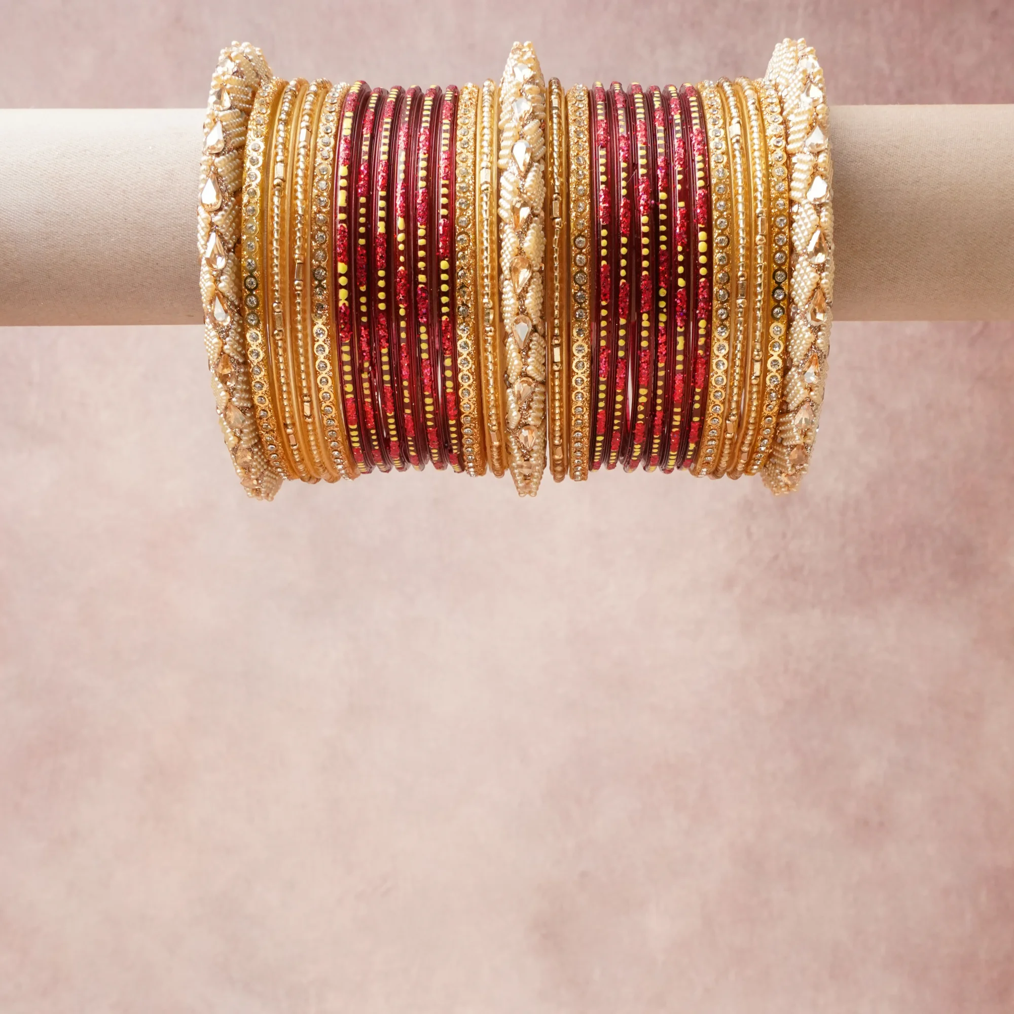 A grounding Champagne Gold forms the heart of the set, while touches of Burgundy, Ivory, Poppy Red, Polished Gold add charm.

A thoughtful composition of Metal Alloy, Glass, Faux Pearls, Glass Rhinestones, designed to feel complete without being heavy.
Each element layers seamlessly, creating a look that is refined, wearable and quietly striking.